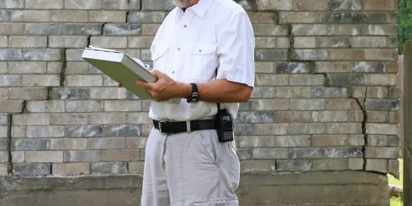 Claims adjuster reviewing a property inspection